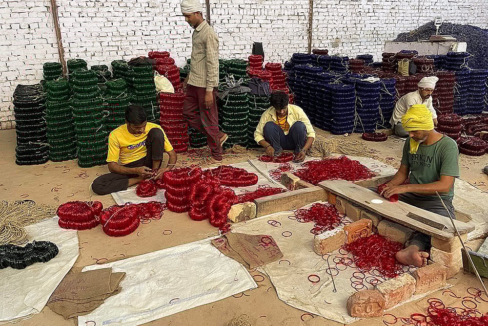 | Photo: PTI/Uzmi Athar : Bangle Industry in UP's Firozabad